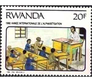Teacher seated at desk - East Africa / Rwanda 1991 - 20